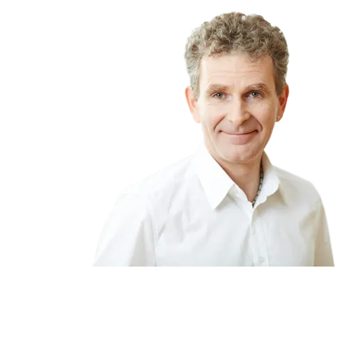 Geschäftsführer Jörg Braun vor neutralen Hintergrund.